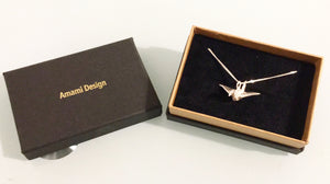 Sterling silver origami crane necklace.